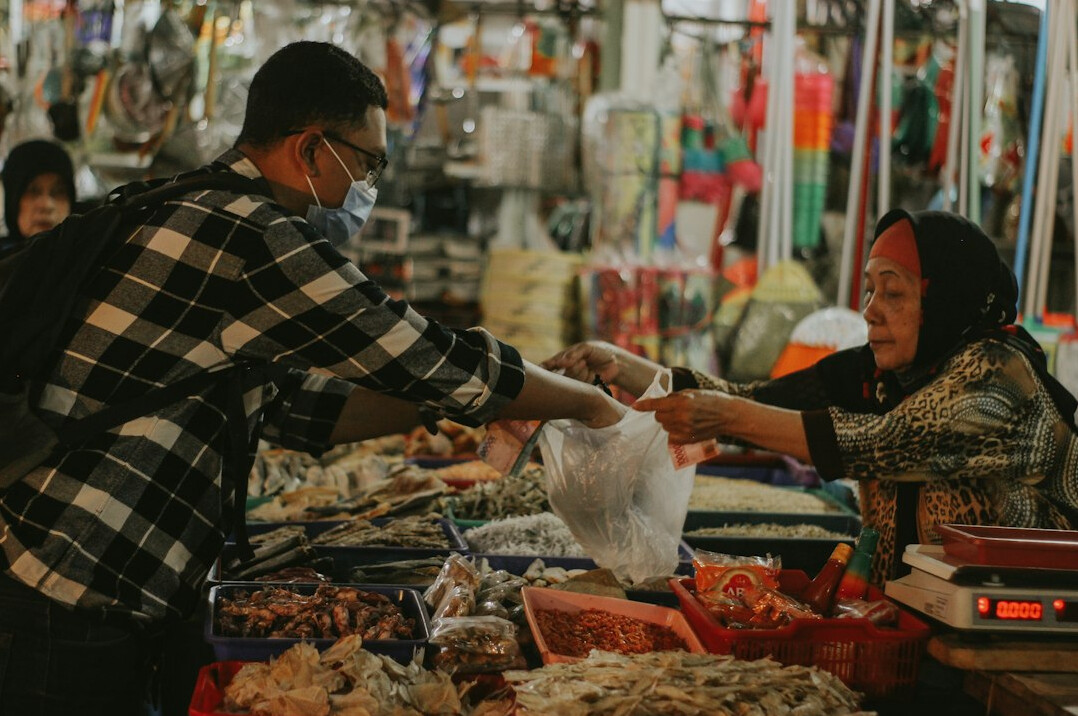 Local vendor and customers at an open air market in Chile